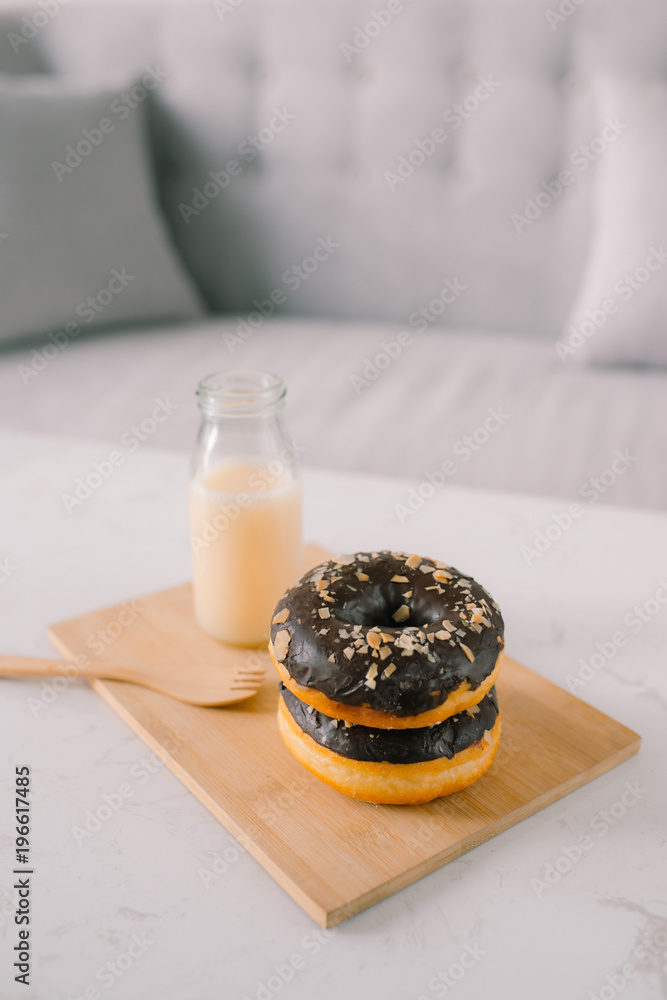 Bottle of milk and donuts, selective focus