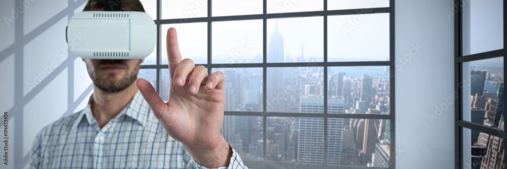 Composite image of man gesturing while using virtual reality