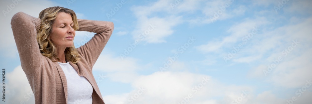 Composite image of mature woman stretching with eyes closed  