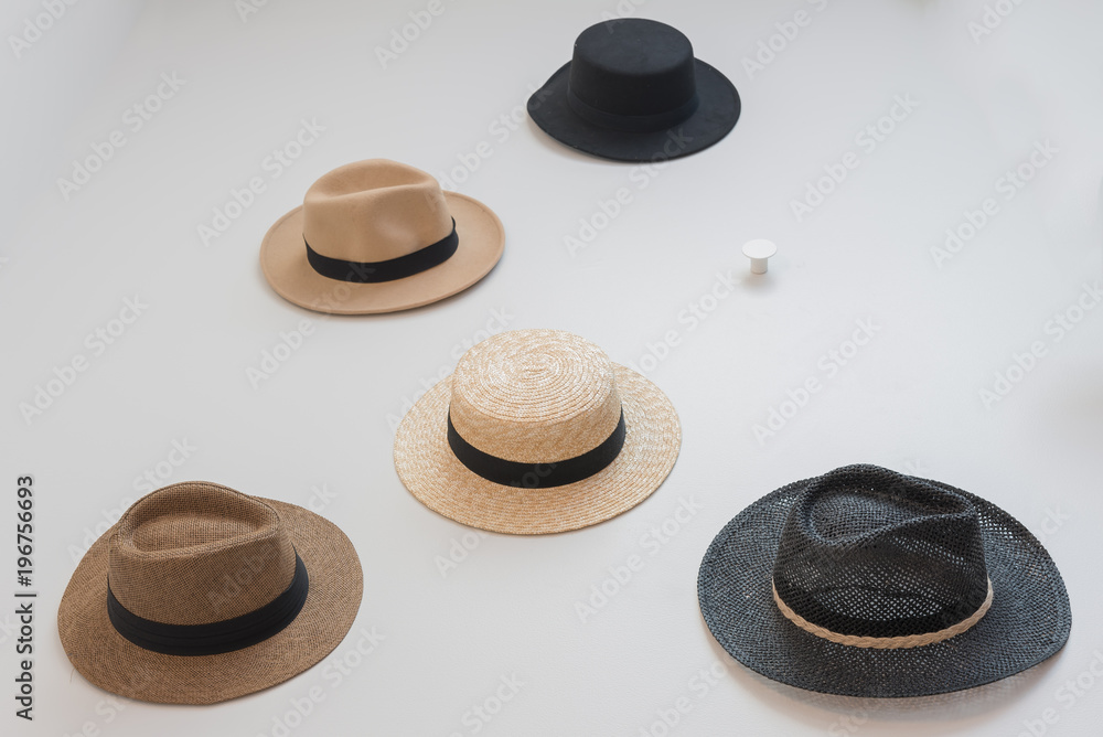 hats hanging on wall