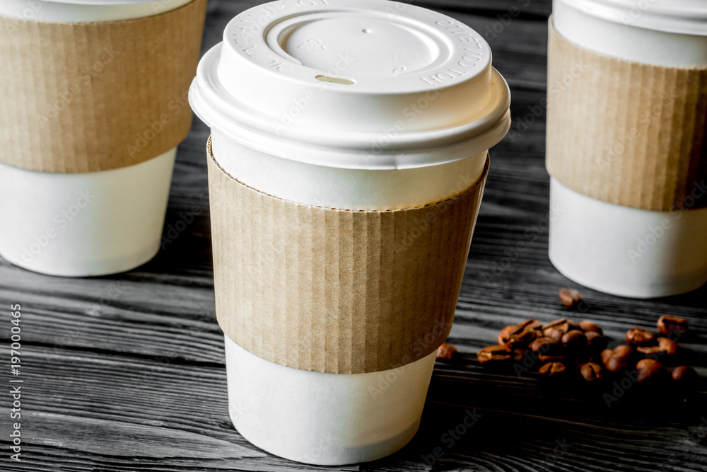 coffee cup to go at wooden background