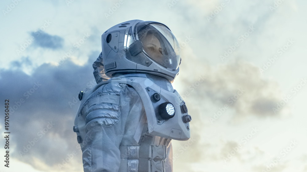 Shot of Female Astronaut in the Space Suit Looking Around Frozen Alien Planet. Advanced Technologies