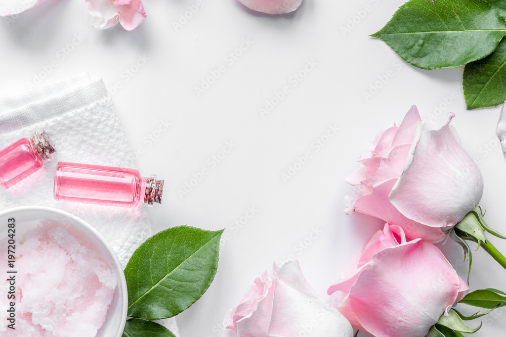 organic cosmetic with rose oil on white background top view