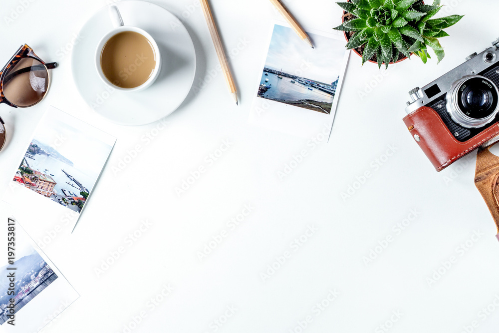 tourist stuff with coffee and photos on white background top vie