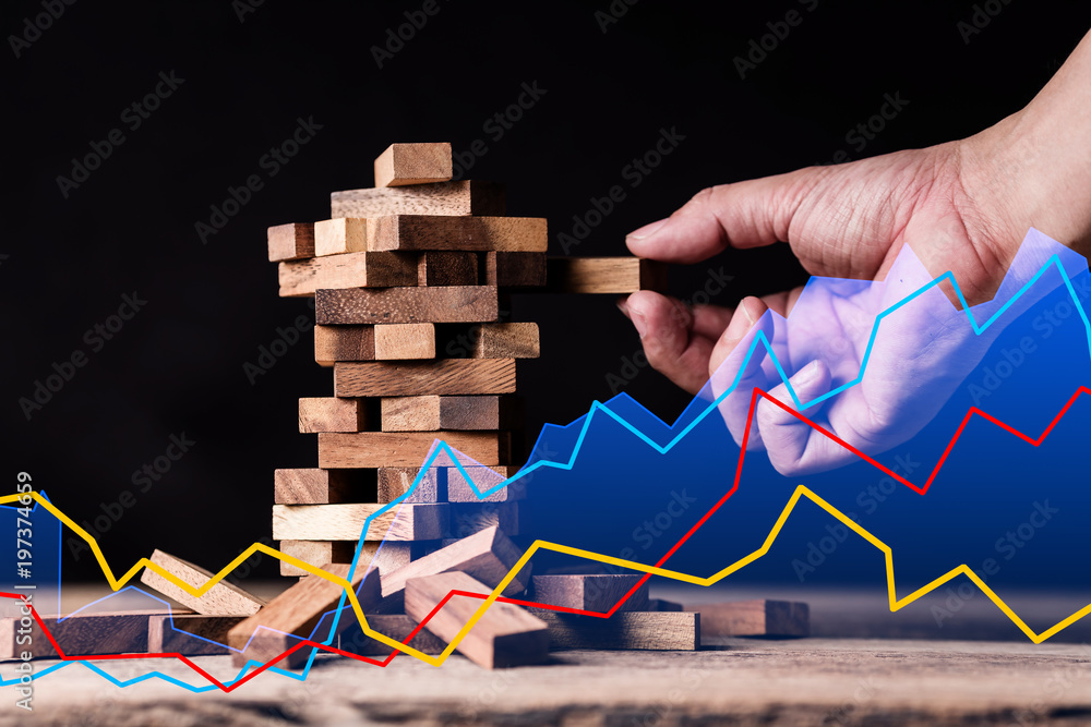 risk reward in business planning and analyzing with hand and graph chart background