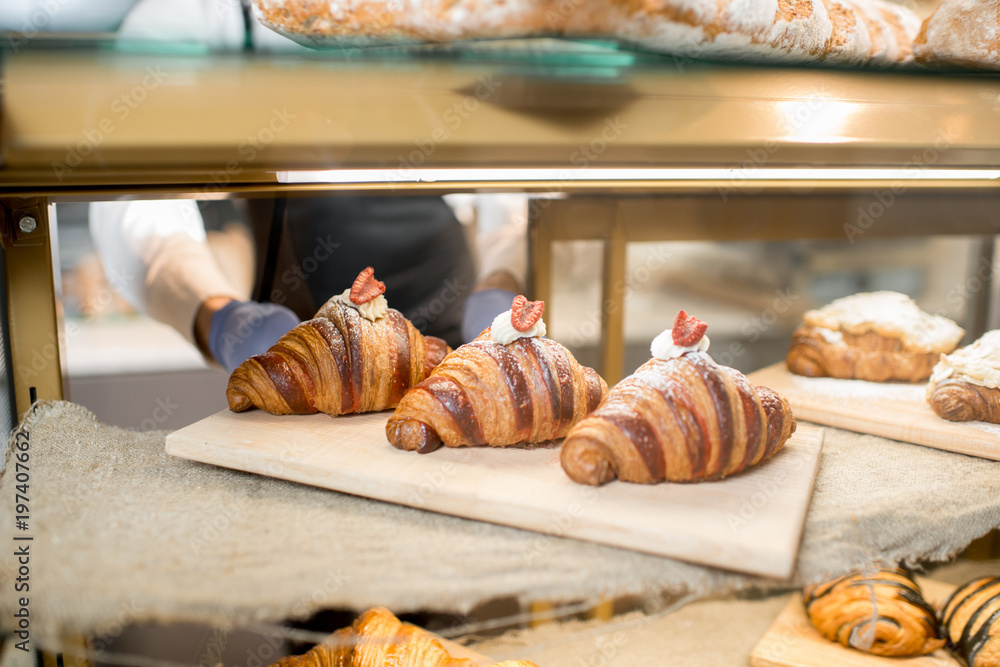 Delicious croissants on the store showcase of the bakery house