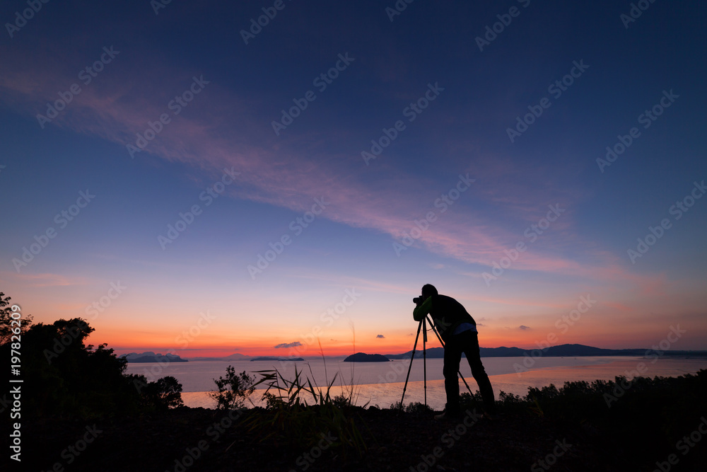 Professional photography man take a photo sunset or sunrise dramatic sky over the tropical sea in ph