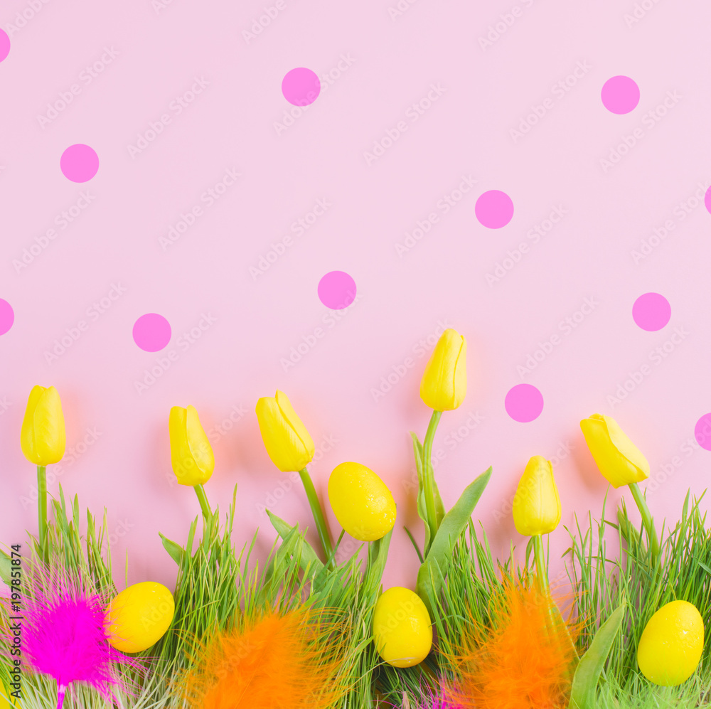 Beautiful Easter bright vivid spring blooming tulip flowers, colorful eggs, fresh grass and colourfu