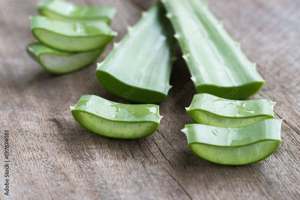 fresh leaf and sliced of aloe vera on wood