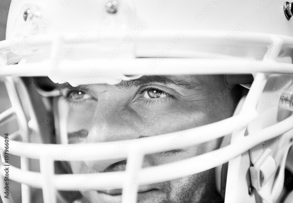 Man wearing Amerian football helmet