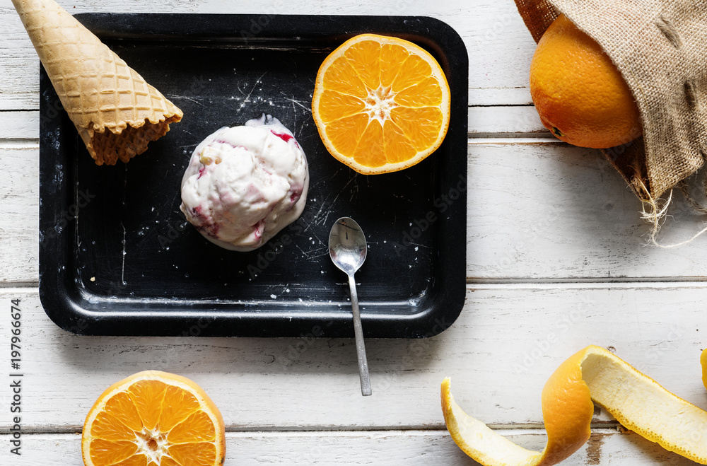 Delicious ice cream and oranges