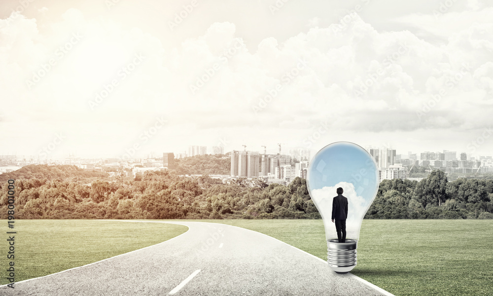 Businessman inside light bulb