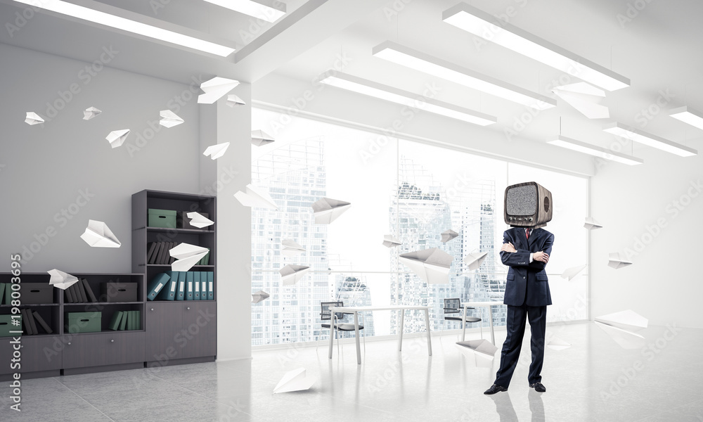 Businessman with an old TV instead of head.