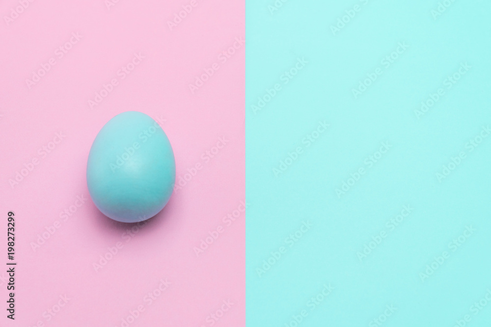 blue easter egg put on punchy pastel background