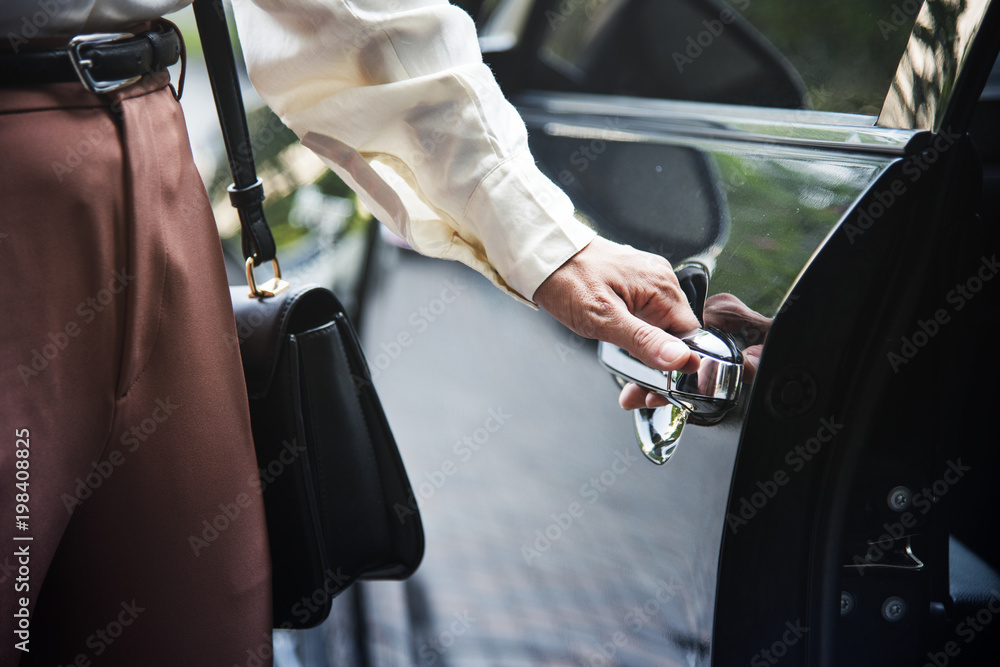 Woman getting into a car