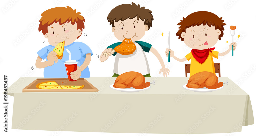 Three boys eating chicken and pizza at the dining table