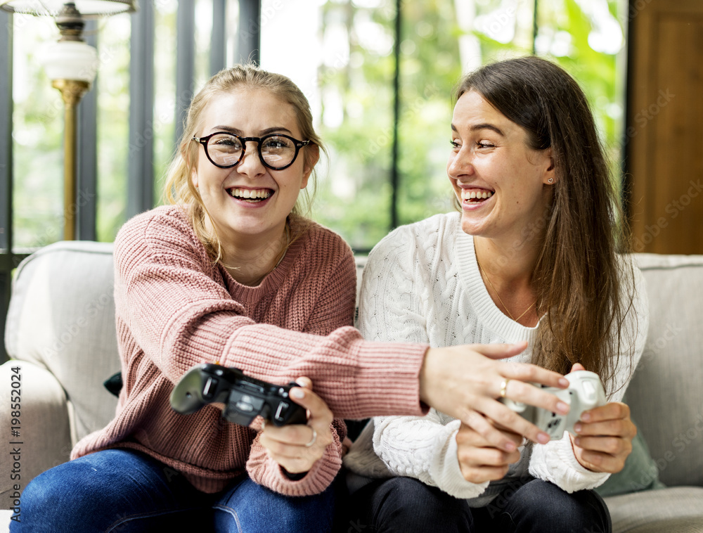 Women playing video game together