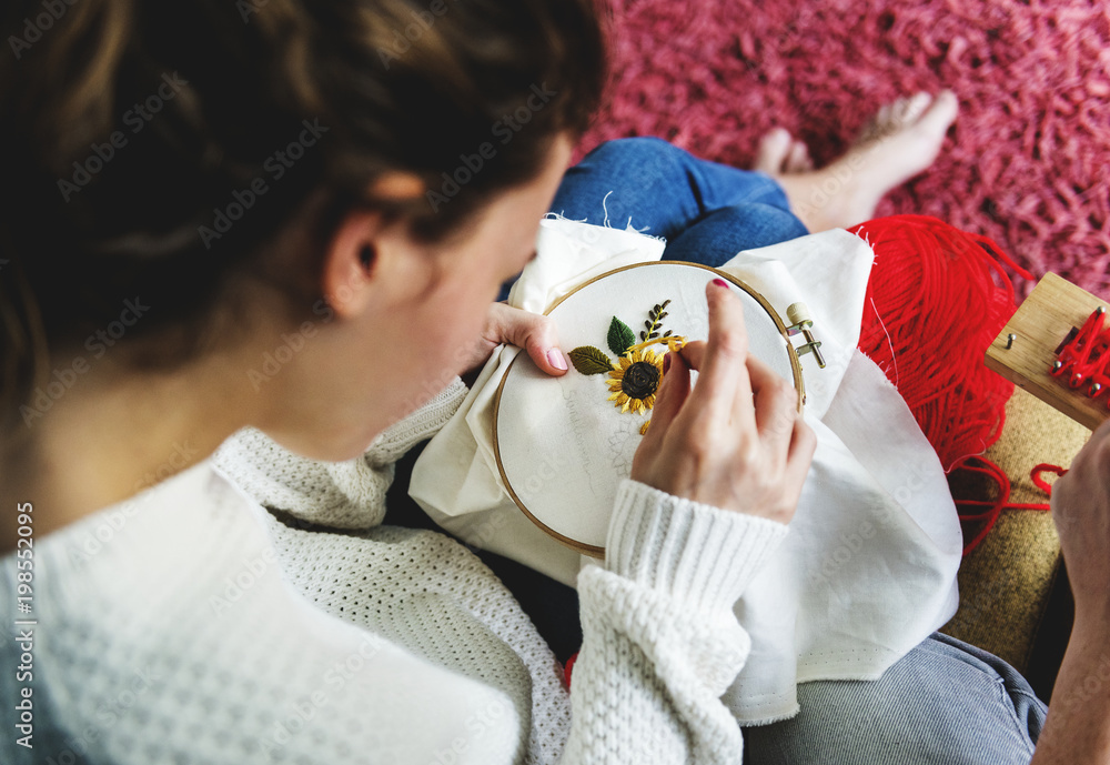 Young girl doing some needlework