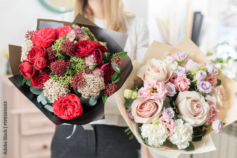 beautiful luxury bouquet of mixed flowers in woman hand. the work of the florist at a flower shop. A