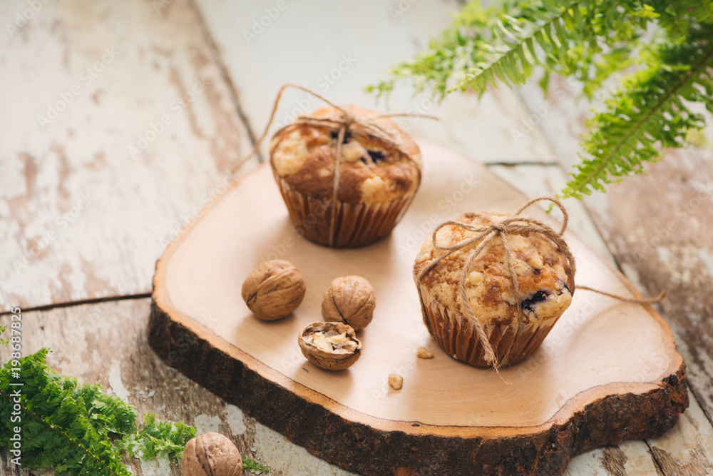 Dellicious homemade nut muffins on table. Sweet pastries