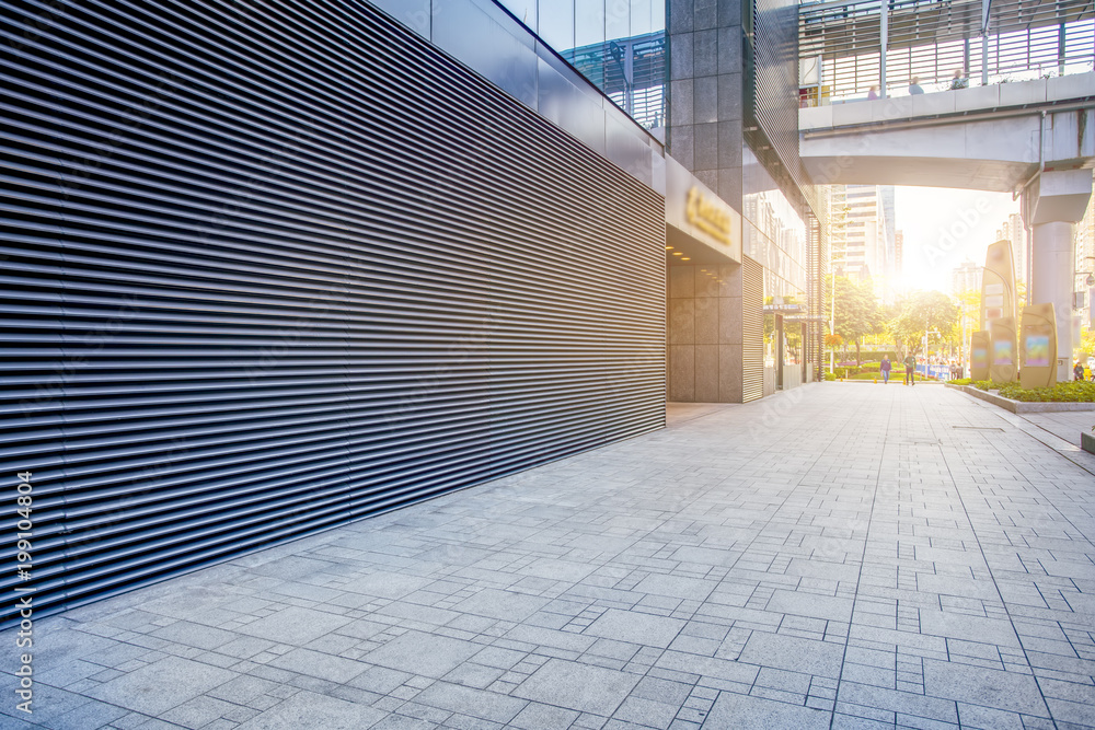 The entrance of modern Enterprise Building is in the facade view of blue tone.