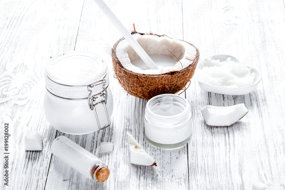 organic cosmetics with coconut on wooden background close up