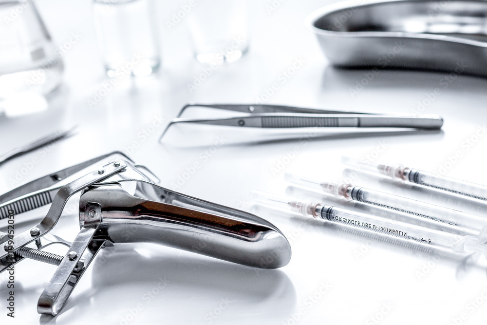 instruments of gynecologist on white background