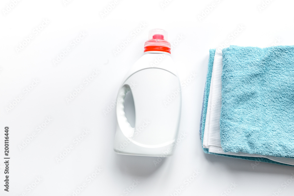 housekeeping set with towels and plastic bottles in laundry top 