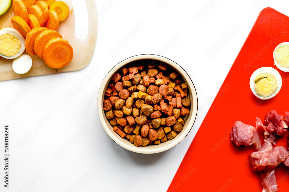 Set of animal food, meat,vegetables and eggs on kitchen top view