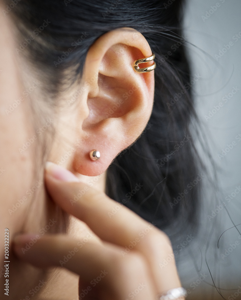 Close up of woman's ear with earrings