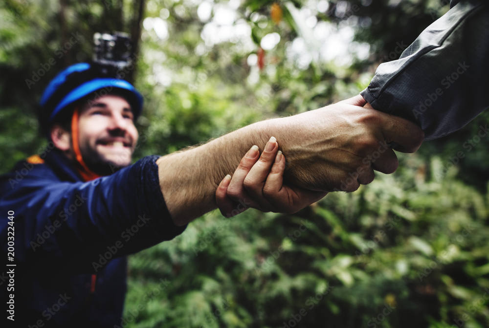 Hand holding hand helping