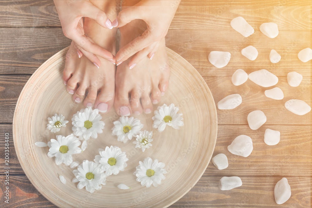 Photo of a female feet and flower