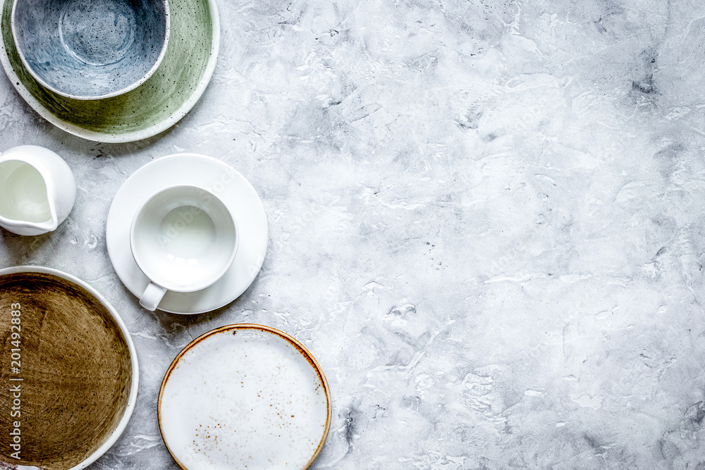 ceramic tableware top view on stone background mock up