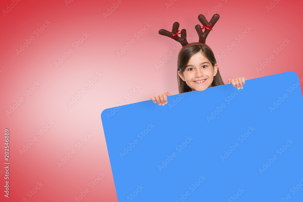 Composite image of festive little girl showing card against red vignette