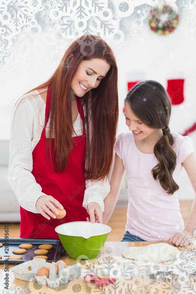 节日母女一起在雪花框架下烘烤