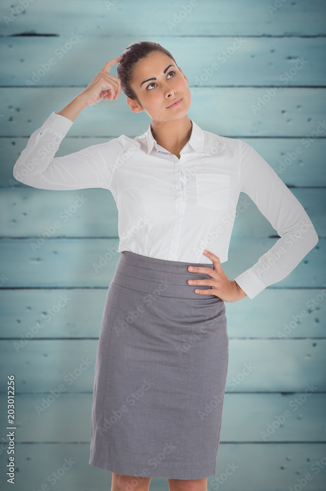 Worried businesswoman against wooden planks