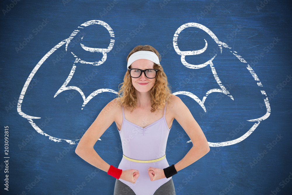 Geeky hipster posing in sportswear against blue chalkboard