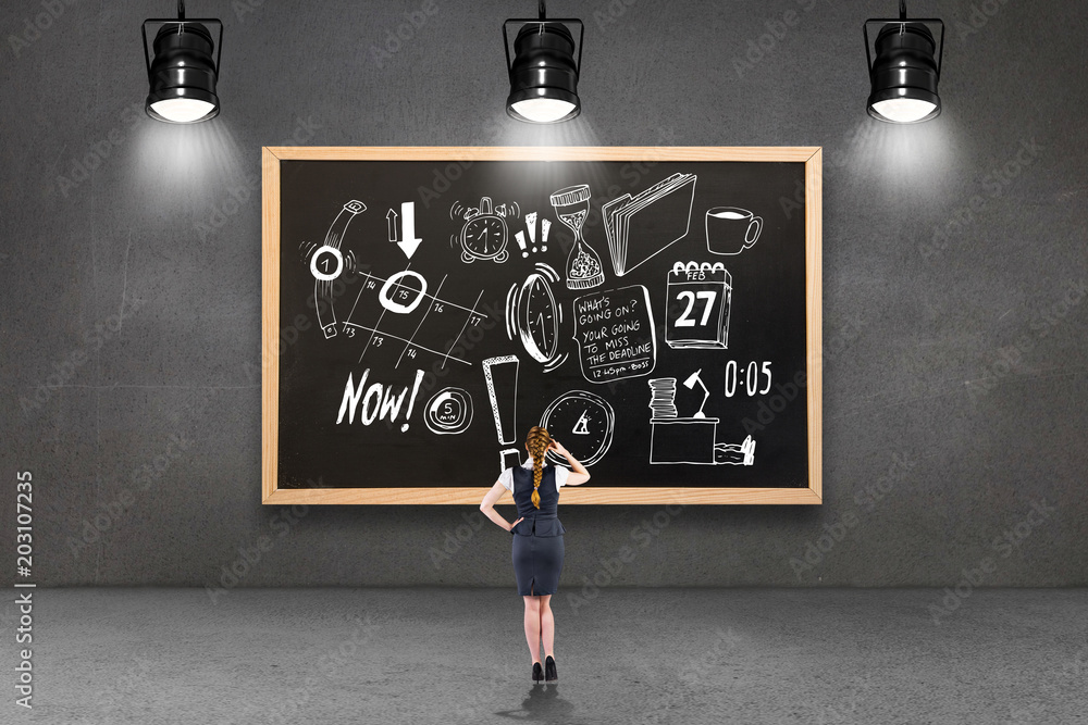 Redhead businesswoman scratching her head against blackboard with copy space