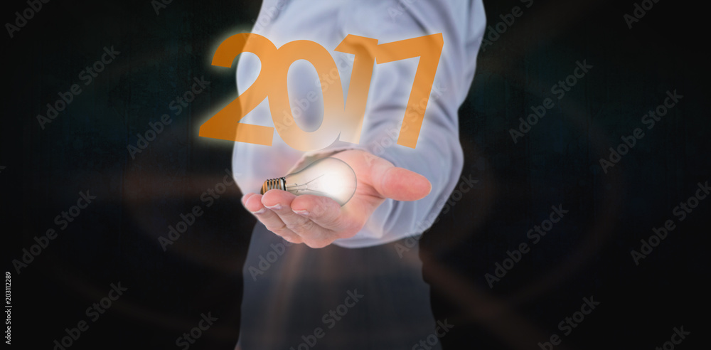 Businesswoman presenting with hand against dark background