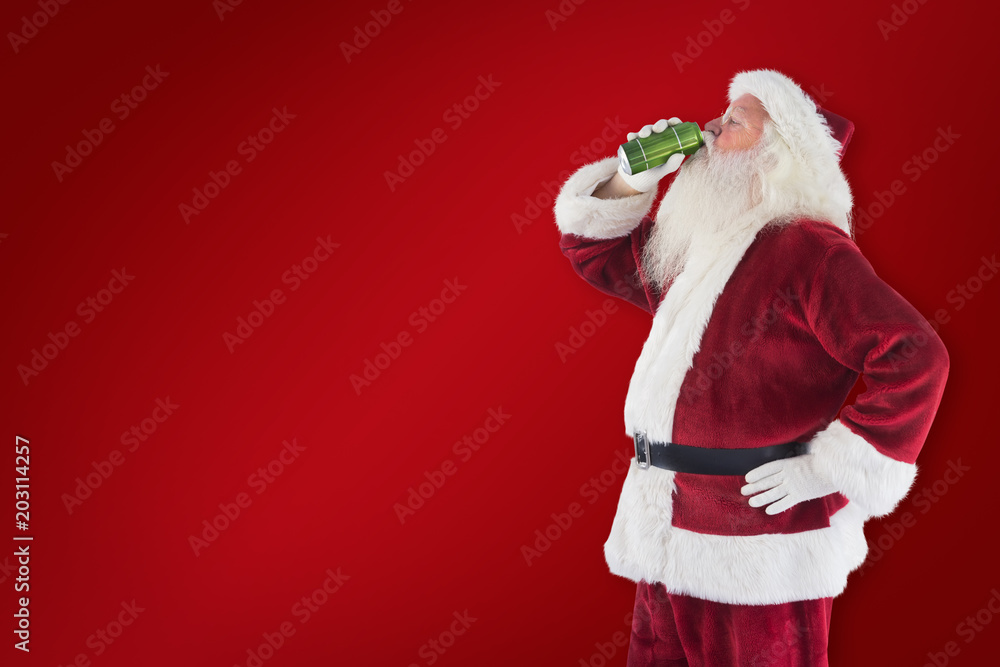 Father Christmas drinks beer with closed eyes against red background