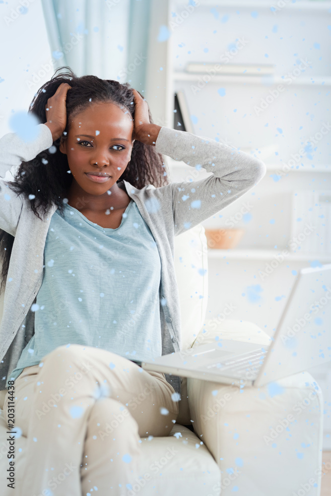 Woman not happy about her laptop against snow falling