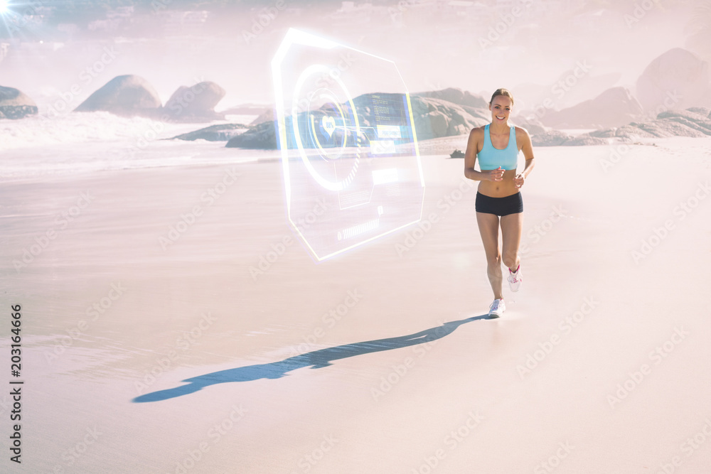 Fit woman smiling and jogging on the beach against fitness interface