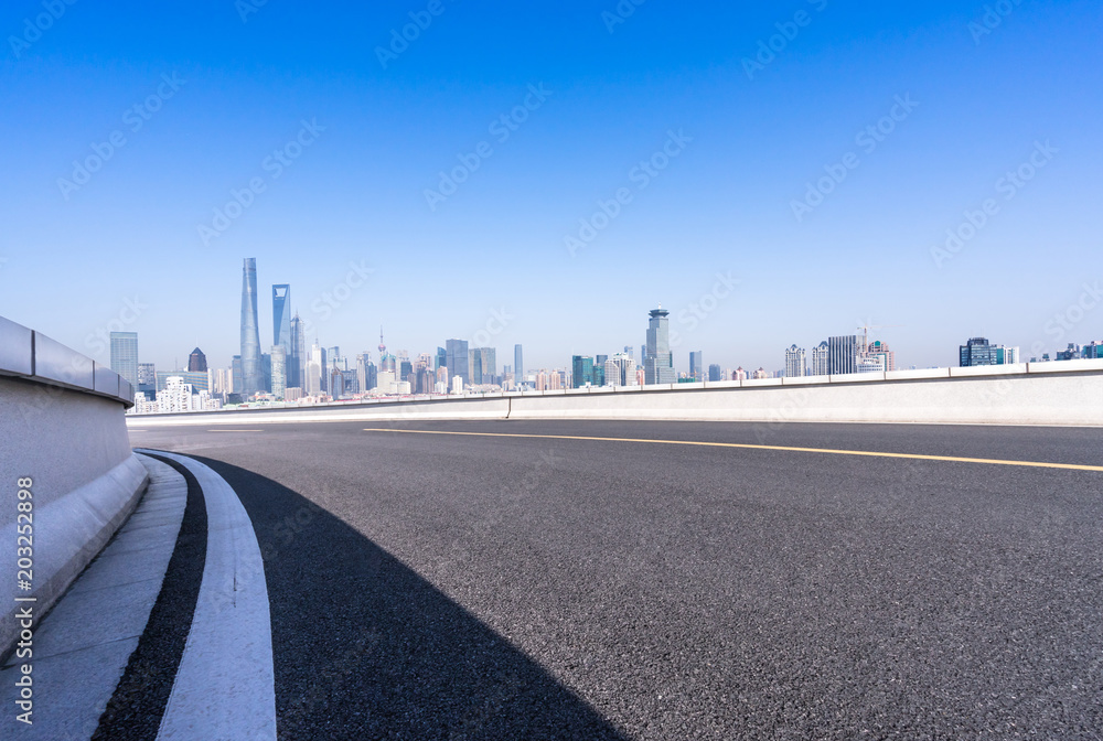 empty asphalt road with modern building in urban