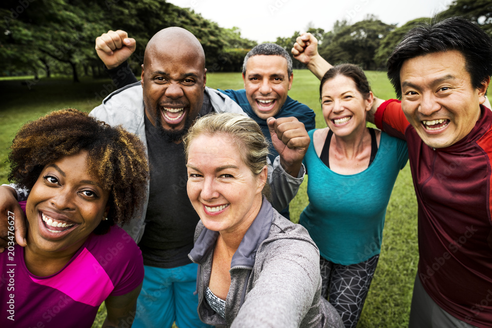 Group of cheerful diverse friends in the park