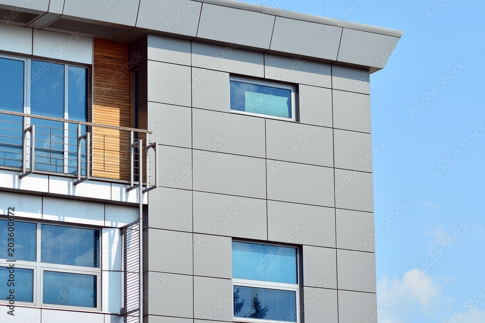 Urban abstract background, detail of modern glass facade, office business building.