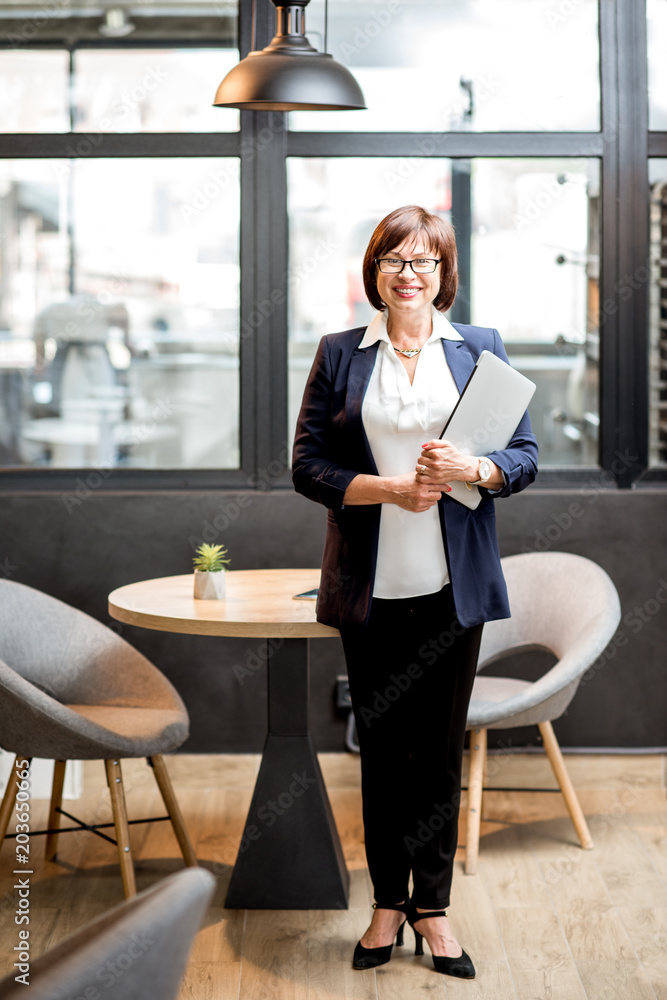 Senior business woman portrait indoors