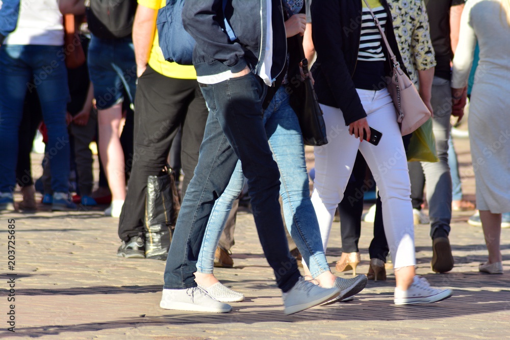 People walking on big city street, blurred motion crossing abstract