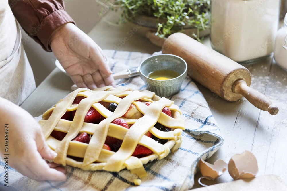 A person baking fruit pie food photography recipe idea