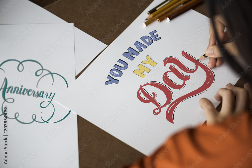 An artist creating hand lettering artwork