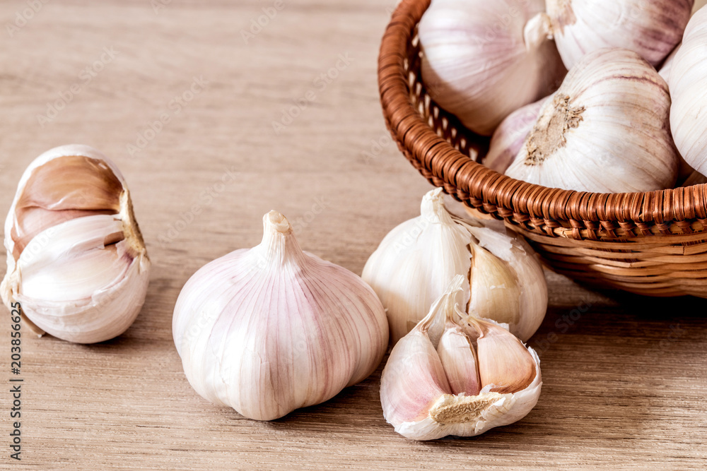 Close up  group of garlic on kitchen wooden table